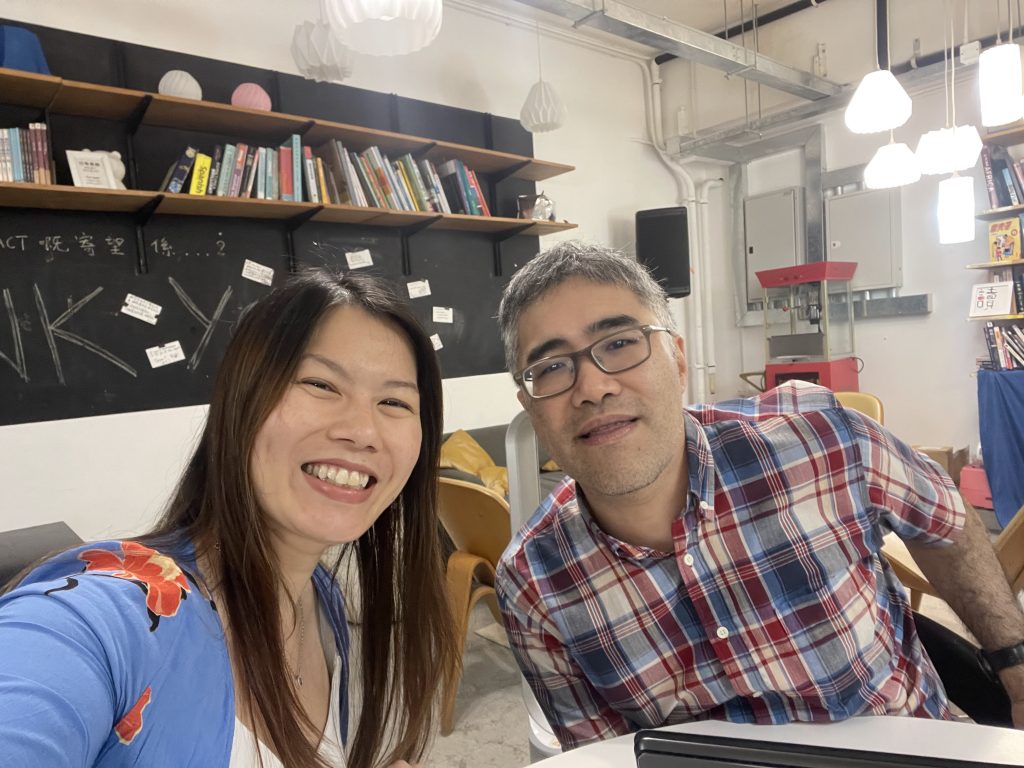 Hong Kong social impact practitioners Victoria Wong and Jonathan Mok smiling at the camera.