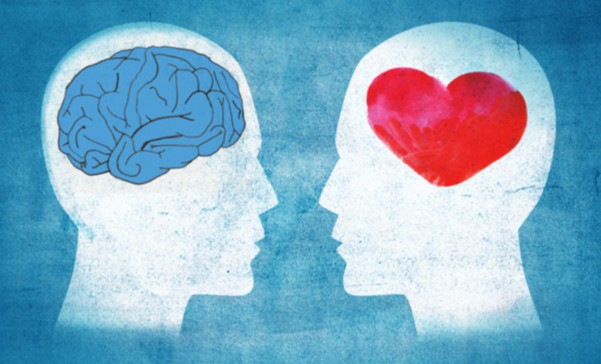 Two silhouette heads facing each other on a blue background; one has a brain, the other a red heart, symbolizing logic versus emotion.
